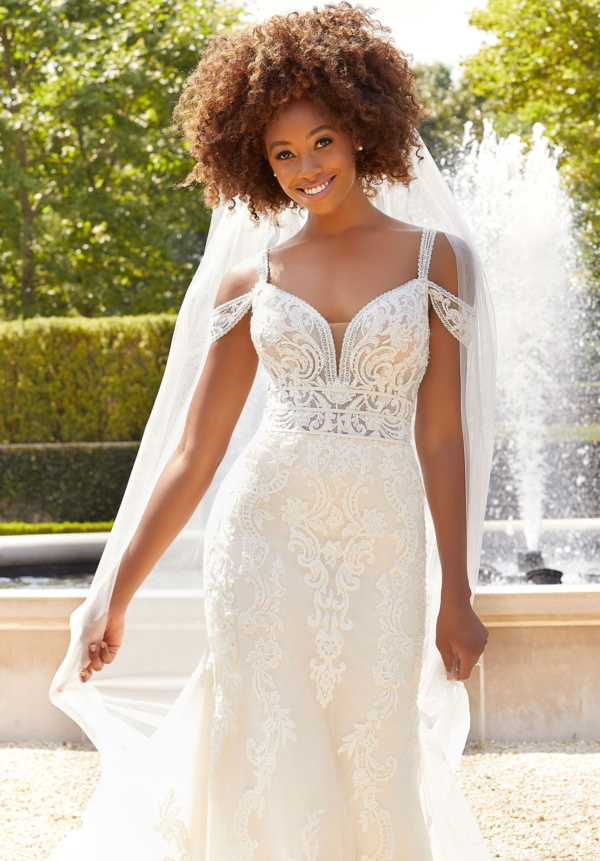 Both sweet and sultry, our Beatrix wedding gown is full of sculptured medallion lace appliqués covered in pearl and crystal beading.