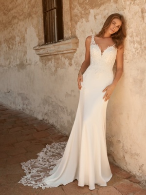 Simple crepe wedding dress with a scalloped lace train